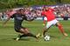NYON, SWITZERLAND - APRIL 14: Adama Traore of FC Barcelona (L) competes for the ball with Rebocho of SL Benfica during the UEFA Youth League Final match between Benfica Lisbon and FC Barcelona at Colovray Stadion on April 14, 2014 in Nyon, Switzerland. (P