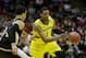 MILWAUKEE, WI - MARCH 20: Glenn Robinson III #1 of the Michigan Wolverines drives against Lee Skinner #34 of the Wofford Terriers in the second half during the second round of the 2014 NCAA Men's Basketball Tournament at BMO Harris Bradley Center on Marc