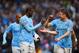 MANCHESTER, ENGLAND - MARCH 22: Yaya Toure of Manchester City celebrates scoring their second goal with James Milner of Manchester City during the Barclays Premier League match between Manchester City and Fulham at Etihad Stadium on March 22, 2014 in Man