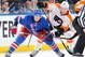 NEW YORK, NY - MARCH 26: J.T. Miller #10 of the New York Rangers battles for the puck against Michael Raffl #12 of the Philadelphia Flyers at Madison Square Garden on March 26, 2014 in New York City. The New York Rangers won 3-1. (Photo by Scott Levy/NHLI