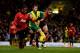 NORWICH, ENGLAND - DECEMBER 28: Patrice Evra and Nemanja Vidic Manchester United battle with Wes Hoolahan of Norwich City during the Barclays Premier League match between Norwich City and Manchester United at Carrow Road on December 28, 2013 in Norwich,