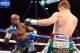 Sep 14, 2013; Las Vegas, NV, USA; Floyd Mayweather Jr. (blue gloves) and Canelo Alvarez battle during their during their WBC and WBA super welterweight titles fight at MGM Grand Garden Arena. Mandatory Credit: Jayne Kamin-Oncea-USA TODAY Sports
