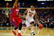 BUFFALO, NY - MARCH 20: LaQuinton Ross #10 of the Ohio State Buckeyes drives to the basket as Devin Oliver #5 of the Dayton Flyers defends during the second round of the 2014 NCAA Men's Basketball Tournament at the First Niagara Center on March 20, 2014 i