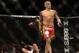 Dec 28, 2013; Las Vegas, NV, USA; Dustin Poirier (red gloves) walks away from Diego Brandao (blue gloves) after winning his UFC Middleweight Bout at the MGM Grand Garden Arena. Mandatory Credit: Jayne Kamin-Oncea-USA TODAY Sports