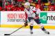 NEWARK, NJ - APRIL 04: Mike Green #52 of the Washington Capitals plays the puck against the New Jersey Devils during the game at the Prudential Center on April 4, 2014 in Newark, New Jersey. (Photo by Andy Marlin/NHLI via Getty Images)