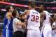 Oct 31, 2013; Los Angeles, CA, USA; NBA referee Mark Ayotte (56) and Los Angeles Clippers power forward Blake Griffin (32) separate center DeAndre Jordan (6) after he was fouled by Golden State Warriors center Andrew Bogut (far left) in the second quart