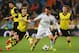 MADRID, SPAIN - APRIL 02: Isco of Real Madrid is closed down by Marco Reus (L) of Borussia Dortmund during the UEFA Champions League Quarter Final first leg match between Real Madrid and Borussia Dortmund at Estadio Santiago Bernabeu on April 2, 2014 in