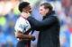 CARDIFF, WALES - MARCH 22: Brendan Rodgers (R) the manager of Liverpool chats with Raheem Sterling after his side's 6-3 victory during the Barclays Premier League match between Cardiff City and Liverpool at the Cardiff City Stadium on March 22, 2014 in C