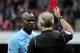 LONDON, ENGLAND - APRIL 08: Referee Martin Atkinson shows Mario Balotelli of Man City a red card during the Barclays Premier League match between Arsenal and Manchester City at Emirates Stadium on April 8, 2012 in London, England. (Photo by Michael Reg