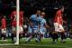 MANCHESTER, ENGLAND - APRIL 30: Vincent Kompany of Manchester City celebrates scoring the opening goal during the Barclays Premier League match between Manchester City and Manchester United at the Etihad Stadium on April 30, 2012 in Manchester, England.