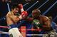LAS VEGAS, NV - APRIL 12: Timothy Bradley throws a right hand at Manny Pacquiao at the MGM Grand Garden Arena on April 12, 2014 in Las Vegas, Nevada. (Photo by Jeff Gross/Getty Images)