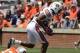 Apr 20, 2013; Auburn, AL, USA; Auburn linebacker Justin Garrett (26) scores a defensive touchdown on a high snap lose ball past Auburn quarterback Jonathan Wallace (12) during their A-Day spring game at Jordan-Hare Stadium. Mandatory Credit: John David Me