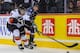 CALGARY, AB - MARCH 15: Kenton Helgesen #3 of the Calgary Hitmen battles for the puck against Sam Reinhart #23 of the Kootenay Ice during a WHL game at Scotiabank Saddledome on March 15, 2014 in Calgary, Alberta, Canada. (Photo by Derek Leung/Getty Images