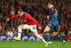 MANCHESTER, ENGLAND - APRIL 01: Toni Kroos of Bayern Muenchen marshalls Wayne Rooney of Manchester United during the UEFA Champions League Quarter Final first leg match between Manchester United and FC Bayern Muenchen at Old Trafford on April 1, 2014 in