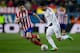 MADRID, SPAIN - FEBRUARY 11: Carlos Casemiro (R) of Real Madrid CF competes for the ball with Gabi Fernandez (L) of Atletico de Madrid during the Copa del Rey semi-final second leg match between Club Atletico de Madrid and Real Madrid CF at Vicente Calder