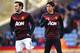 LONDON, ENGLAND - FEBRUARY 22: Juan Mata and Shinji Kagawa of Manchester United warm up prior to the Barclays Premier League match between Crystal Palace and Manchester United at Selhurst Park on February 22, 2014 in London, England. (Photo by Laurence G