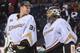 CALGARY, AB - MARCH 26: Frederik Andersen #31 (L) and Jonas Hiller #1 of the Anaheim Ducks celebrate after defeating the Calgary Flames during an NHL game at Scotiabank Saddledome on March 26, 2014 in Calgary, Alberta, Canada. The Ducks defeated the Flame