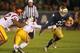 SOUTH BEND, IN - OCTOBER 19: Cam McDaniel #33 of the Notre Dame Fighting Irish breaks a tackle by Su'a Cravens #21 of the University of Southern California Trojans at Notre Dame Stadium on October 19, 2013 in South Bend, Indiana. (Photo by Jonathan Dani