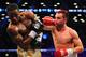 NEW YORK, NY - JUNE 22: Paulie Malignaggi (R) swings on Adrien Broner during their WBA Welterweight Title bout at Barclays Center on June 22, 2013 in the Brooklyn borough of New York City. (Photo by Al Bello/Getty Images)