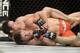 Apr 16, 2014; Quebec City, Quebec, Canada; Michael Bisping (red gloves) fights against Tim Kennedy (blue gloves) during their middleweight bout at Colisee Pepsi. Mandatory Credit: Eric Bolte-USA TODAY Sports