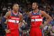 OAKLAND, CA - JANUARY 28: Bradley Beal #3 chats with teammate John Wall #2 of the Washington Wizards while facing the Golden State Warriors on January 28, 2014 at Oracle Arena in Oakland, California. NOTE TO USER: User expressly acknowledges and agrees th