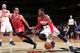WASHINGTON, DC - APRIL 5: John Wall #2 of the Washington Wizards drives against Kirk Hinrich #12 of the Chicago Bulls during the game at the Verizon Center on April 5, 2014 in Washington, DC. NOTE TO USER: User expressly acknowledges and agrees that, by d