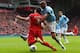 LIVERPOOL, ENGLAND - APRIL 13: Vincent Kompany of Manchester City challenges Luis Suarez of Liverpool during the Barclays Premier League match between Liverpool and Manchester City at Anfield on April 13, 2014 in Liverpool, England. (Photo by Alex Lives