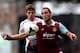 LONDON, ENGLAND - APRIL 06: Andy Carroll of West Ham controls the ball as Jon Flanagan of Liverpool closes during the Barclays Premier League match between West Ham United and Liverpool at Boleyn Ground on April 6, 2014 in London, England. (Photo by Mik