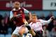 LONDON, ENGLAND - APRIL 06: Winston Reid of West Ham and Lucas Leiva of Liverpool compete for the ball during the Barclays Premier League match between West Ham United and Liverpool at Boleyn Ground on April 6, 2014 in London, England. (Photo by Mike He