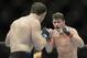 Apr 16, 2014; Quebec City, Quebec, Canada; Michael Bisping (red gloves) fights against Tim Kennedy (blue gloves) during their middleweight bout at Colisee Pepsi. Mandatory Credit: Eric Bolte-USA TODAY Sports