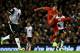 LIVERPOOL, ENGLAND - DECEMBER 4: Luis Suarez of Liverpool scores his first goal from a long range effort during the Barclays Premier League match between Liverpool and Norwich City at Anfield on December 4, 2013 in Liverpool, England. (Photo by Jan Kru