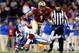 CHARLOTTE, NC - DECEMBER 07: Wide receiver Kelvin Benjamin #1 of the Florida State Seminoles runs with the ball as cornerback Deondre Singleton #33 of the Duke Blue Devils defends during the ACC Championship game at Bank of America Stadium on December 7,