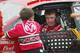A (even younger) Chase Elliott chats with his famous father Bill before a race back in the day.