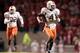 RALEIGH, NC - OCTOBER 23: Devin Hester #4 of the Miami Hurricanes returnns the opening kickoff 100 yards for a touchdown against the North Carolina State Wolfpack during an Atlantic Coast Conference game October 23, 2004, at Carter-Finley Stadium in Ralei
