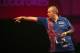 LONDON, ENGLAND - DECEMBER 20: Phil Taylor of England throws during his second round match against Michael Smith of England during the Ladbrokes.com World Darts Championship on Day Eight at Alexandra Palace on December 20, 2013 in London, England. (Photo