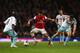 LONDON, ENGLAND - APRIL 15: Santi Cazorla of Arsenal (C) takes on Pablo Armero (L) and Mark Noble of West Ham United (R) during the Barclays Premier League match between Arsenal and West Ham United at Emirates Stadium on April 15, 2014 in London, England