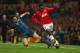 MANCHESTER, ENGLAND - APRIL 01: Javi Martinez of Bayern Muenchen tackles Danny Welbeck of Manchester United during the UEFA Champions League Quarter Final first leg match between Manchester United and FC Bayern Muenchen at Old Trafford on April 1, 2014 i