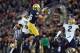 Nov 2, 2013; South Bend, IN, USA; Notre Dame Fighting Irish tight end Troy Niklas (85) catches a pass for a first down in front of Navy Midshipmen linebacker Cody Peterson (53) in the fourth quarter at Notre Dame Stadium. Notre Dame won 38-34. Mandatory C