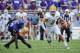 Sep 7, 2013; Fort Worth, TX, USA; Southeastern Louisiana Lions quarterback Bryan Bennett (3) runs past TCU Horned Frogs linebacker Marcus Mallet (54) during the game at Amon G. Carter Stadium. Mandatory Credit: Kevin Jairaj-USA TODAY Sports