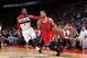 WASHINGTON, DC - APRIL 5: D.J. Augustin #14 of the Chicago Bulls drives against John Wall #2 of the Washington Wizards during the game at the Verizon Center on April 5, 2014 in Washington, DC. NOTE TO USER: User expressly acknowledges and agrees that, by