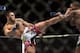Jan 15, 2014; Duluth, GA, USA; Lorenz Larkin (red gloves) fights Brad Tavares (blue gloves) during UFC Fight Night at Gwinnett Center. Mandatory Credit: Joshua S. Kelly-USA TODAY Sports