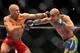 LAS VEGAS - JULY 11: (L-R) Georges St. Pierre battles Thiago Alves during their welterweight title bout during UFC 100 on July 11, 2009 in Las Vegas, Nevada. (Photo by Jon Kopaloff/Getty Images)