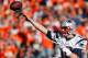 DENVER, CO - JANUARY 19: Tom Brady #12 of the New England Patriots throws a pass against the Denver Broncos during the AFC Championship game at Sports Authority Field at Mile High on January 19, 2014 in Denver, Colorado. (Photo by Kevin C. Cox/Getty Im