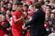 LIVERPOOL, ENGLAND - APRIL 13: Liverpool Manager Brendan Rodgers congratulates Philippe Coutinho as he is substituted during the Barclays Premier League match between Liverpool and Manchester City at Anfield on April 13, 2014 in Liverpool, England. (Pho