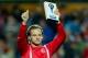 SEVILLE, SPAIN - FEBRUARY 09: Ivan Rakitic of Sevilla FC shows to the audience the Ligga BBVA Best Player of January prior to start the La Liga match between Sevilla FC and FC Barcelona at Estadio Ramon Sanchez Pizjuan on February 9, 2014 in Seville, Spa