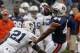 Apr 19, 2014; Auburn, AL, USA; Auburn Tigers running back Cameron Artis-Payne (44) is tackled by defensive back Mackenro Alexander (21) during the first half of the A-Day spring game at Jordan Hare Stadium. Mandatory Credit: John Reed-USA TODAY Sports