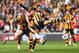 HULL, ENGLAND - APRIL 20: Olivier Giroud (C) of Arsenal is challenged by Liam Rosenior (L) and Curtis Davies (R) of Hull City during the Barclays Premier League match between Hull City and Arsenal at KC Stadium on April 20, 2014 in Hull, England. (Photo