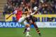 HULL, ENGLAND - APRIL 20: (L-R) Aaron Ramsey of Arsenal and Tom Huddlestone of Hull City challenge for the ball during the Barclays Premier League match between Hull City and Arsenal at KC Stadium on April 20, 2014 in Hull, England. (Photo by Matthew Le