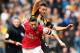 HULL, ENGLAND - APRIL 20: Mesut Oezil (L) of Arsenal holds off Jake Livermore (R) of Hull City during the Barclays Premier League match between Hull City and Arsenal at KC Stadium on April 20, 2014 in Hull, England. (Photo by Scott Heavey/Getty Images)