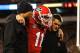 ATHENS, GA - NOVEMBER 23: Quarterback Aaron Murray #11 of the Georgia Bulldogs is escorted off of the field by members of his coaching staff after getting injured during the game against the Kentucky Wildcats at Sanford Stadium on November 23, 2013 in At